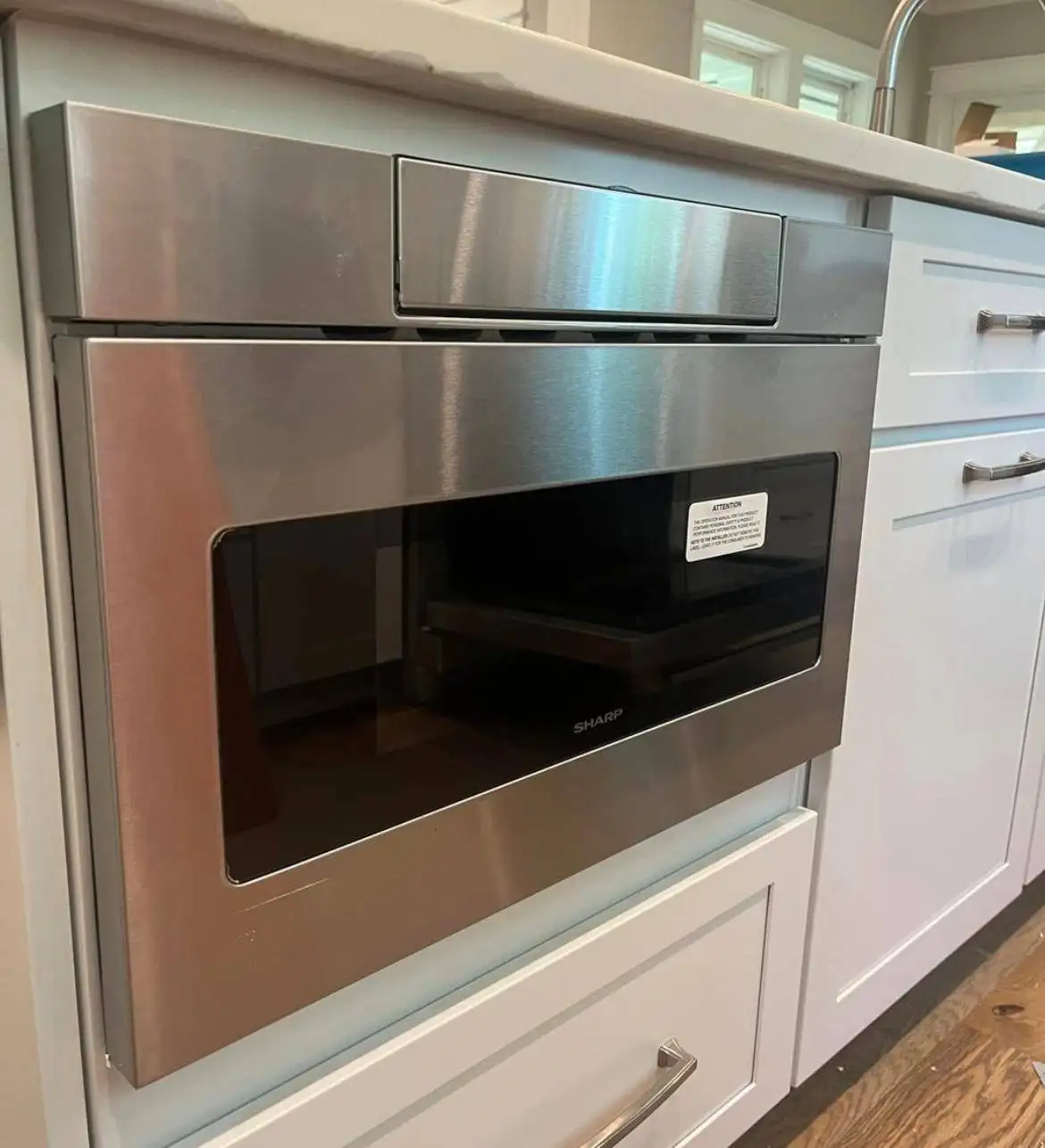 Built-in microwave installed in the kitchen cabinet